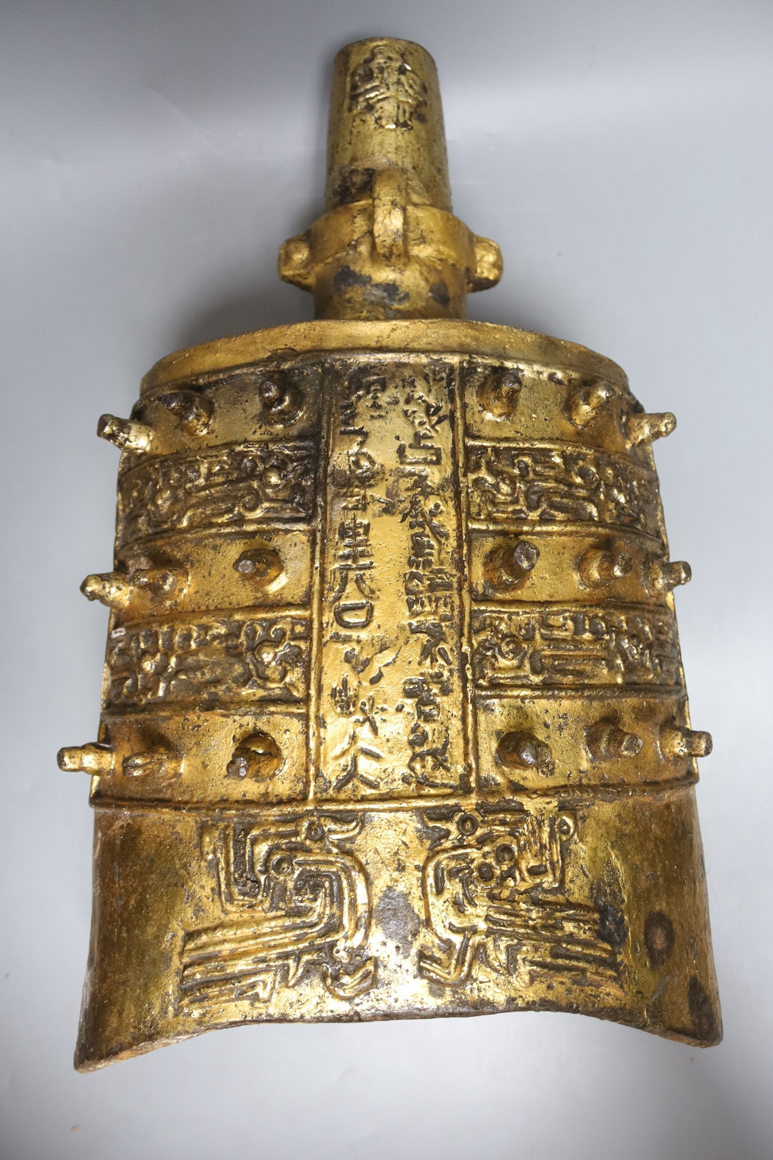 A Chinese gilded iron model of a temple bell, height 50cm